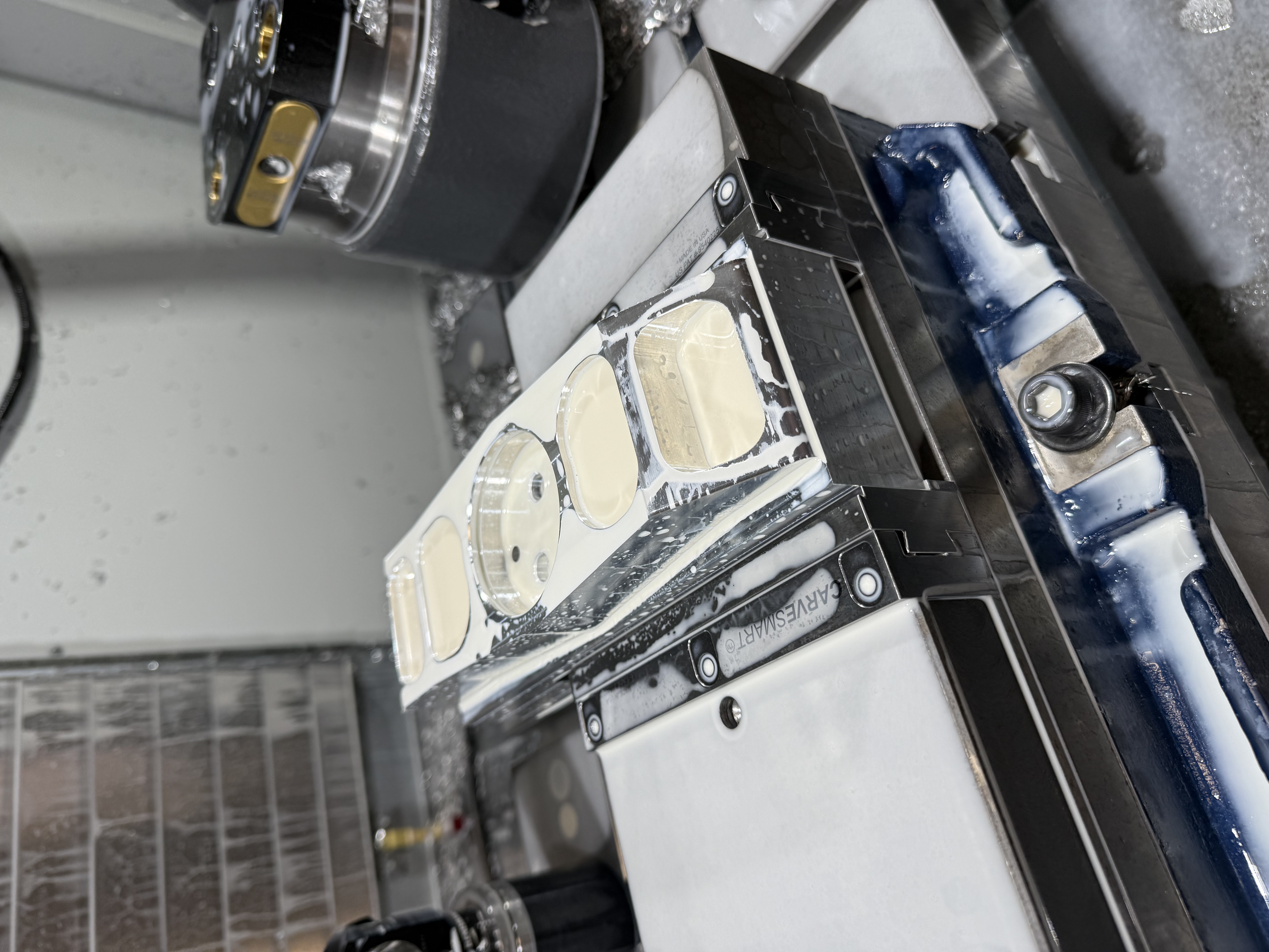 Upright in the CNC mill fixture, mid-operation